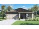Charming one-story home with a well-manicured lawn, featuring a two-car garage and inviting front entrance at 223 Taylor Groves St, Lake Wales, FL 33898