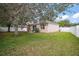 Expansive backyard view featuring a well-manicured lawn and an inviting patio at 2306 Valhalla Dr, Tavares, FL 32778