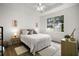 Bedroom with natural lighting, neutral decor, and hardwood floors creating a peaceful and inviting atmosphere at 2306 Valhalla Dr, Tavares, FL 32778