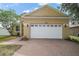 Charming single-Gathering home with a two-car garage and brick paver driveway at 2306 Valhalla Dr, Tavares, FL 32778