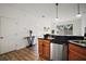 Kitchen with stainless steel appliances, granite countertops, and modern finishes at 2306 Valhalla Dr, Tavares, FL 32778