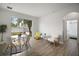 Bright living room with neutral decor and sliding glass door to the backyard patio at 2306 Valhalla Dr, Tavares, FL 32778