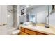 Bathroom featuring a bath/shower combo and vanity with a sink and lots of counter space at 2411 Caravelle Cir, Kissimmee, FL 34746