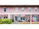 Back of building with enclosed patio spaces at 2411 Caravelle Cir, Kissimmee, FL 34746