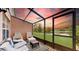 Enclosed patio with stunning lake view, ideal for serene relaxation at 2411 Caravelle Cir, Kissimmee, FL 34746
