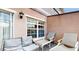 Relaxing covered patio with comfortable seating for enjoying the outdoors at 2411 Caravelle Cir, Kissimmee, FL 34746