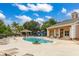 Inviting community pool area featuring lounge chairs, a gazebo, and a fun playground at 2411 Caravelle Cir, Kissimmee, FL 34746