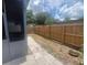 Fenced backyard with stone paver walkway at 2426 Windward Way, Winter Park, FL 32792