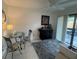Open living room with tile floors, a dining area, and sliding glass doors leading to the patio at 2426 Windward Way, Winter Park, FL 32792
