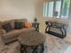 Comfortable living room with neutral decor, stylish rug, and ample seating for relaxation and entertainment at 2426 Windward Way, Winter Park, FL 32792