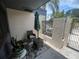 Cozy outdoor seating area with umbrella and potted plants near the entrance at 2426 Windward Way, Winter Park, FL 32792