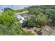 Breathtaking lakefront property with lush landscaping and mature trees offering privacy and serene natural beauty at 2518 Fort Lane Rd, Geneva, FL 32732