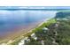 Picturesque aerial view of the property, highlighting its stunning waterfront location and lush landscape at 2518 Fort Lane Rd, Geneva, FL 32732