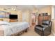 Cozy bedroom featuring a ceiling fan, TV, and comfortable seating area at 2518 Fort Lane Rd, Geneva, FL 32732