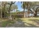 Charming exterior of a home with stone accents and surrounding trees at 2518 Fort Lane Rd, Geneva, FL 32732
