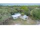 Charming home featuring a new metal roof, a backyard patio and lush green foliage at 2518 Fort Lane Rd, Geneva, FL 32732