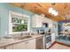 Bright kitchen featuring modern appliances, granite countertops, and ample natural light at 2518 Fort Lane Rd, Geneva, FL 32732