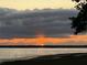 Scenic waterfront view featuring a vibrant sunset over calm waters at 2518 Fort Lane Rd, Geneva, FL 32732