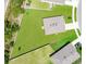 Aerial shot reveals the property's spacious yard, roof, and location within the green neighborhood at 2668 Grand Central Ave, Tavares, FL 32778
