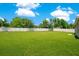 Spacious, well-maintained backyard with a white fence and ample room for gardening or recreation at 2668 Grand Central Ave, Tavares, FL 32778