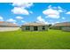 Spacious backyard with lush green grass and ample room for activities at 2668 Grand Central Ave, Tavares, FL 32778