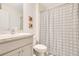 Bathroom featuring a patterned shower curtain, vanity with storage, and modern fixtures at 2668 Grand Central Ave, Tavares, FL 32778