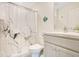 Bathroom featuring a unique shower curtain, vanity with storage, and modern fixtures at 2668 Grand Central Ave, Tavares, FL 32778