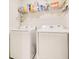 Convenient laundry area with side-by-side washer and dryer at 2668 Grand Central Ave, Tavares, FL 32778