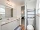 Bright bathroom featuring vanity, lighting, and view into the bedroom at 2729 N Poinciana Blvd # 125, Kissimmee, FL 34746