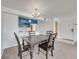 Dining room next to kitchen area and entrance door with chandelier lighting at 2729 N Poinciana Blvd # 125, Kissimmee, FL 34746