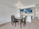 Dining room with chandelier lighting and a full view of the blue-accented kitchen at 2729 N Poinciana Blvd # 125, Kissimmee, FL 34746