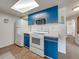 Kitchen offers standard appliances in a cozy space, adjacent to an interior hallway at 2729 N Poinciana Blvd # 125, Kissimmee, FL 34746