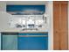Kitchen with stainless steel sink, dishwasher, and view to living area offers a modern design at 2729 N Poinciana Blvd # 125, Kissimmee, FL 34746