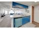 Partial view of the kitchen and living room, featuring standard appliances and natural light at 2729 N Poinciana Blvd # 125, Kissimmee, FL 34746