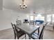 Open floor plan of dining and living room showing seating, TV, and natural light at 2729 N Poinciana Blvd # 125, Kissimmee, FL 34746