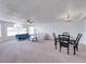 Spacious living room featuring two sofas, a ceiling fan and a dining table set at 2729 N Poinciana Blvd # 125, Kissimmee, FL 34746