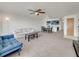 Cozy living room with ceiling fan opens to dining and kitchen area, great for entertaining at 2729 N Poinciana Blvd # 125, Kissimmee, FL 34746