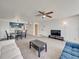 Open concept living and dining area with kitchen access, neutral carpet and bright light at 2729 N Poinciana Blvd # 125, Kissimmee, FL 34746