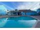 Beautiful community pool with lounge chairs and a clubhouse, offering a relaxing outdoor space for residents at 2729 N Poinciana Blvd # 125, Kissimmee, FL 34746