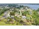 An aerial view of a neighborhood and lake at 2772 Pelham Cir, Deltona, FL 32738