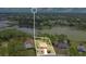 Overhead aerial view of property with adjacent lake and community at 2772 Pelham Cir, Deltona, FL 32738