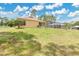 Lush backyard, with screened enclosure, providing lots of space for outdoor activities at 2772 Pelham Cir, Deltona, FL 32738