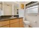 Bathroom with a vanity, a dark countertop, and a toilet at 2772 Pelham Cir, Deltona, FL 32738