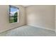 Bright bedroom with a lake view window, carpet, and neutral paint at 2772 Pelham Cir, Deltona, FL 32738