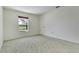 Bright bedroom featuring carpet, neutral paint and a window with outdoor views at 2772 Pelham Cir, Deltona, FL 32738