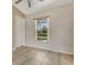 Bright bedroom with tile floors and a window view of the pool, ideal for a relaxing and refreshing living experience at 2772 Pelham Cir, Deltona, FL 32738