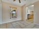 Cozy dining area featuring tile flooring, a view of the backyard, and an open layout to the kitchen, perfect for gatherings at 2772 Pelham Cir, Deltona, FL 32738