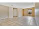 Open living room featuring neutral paint, tile flooring, and a window view at 2772 Pelham Cir, Deltona, FL 32738