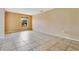 Neutral living room boasting tile floors and a sunlit window at 2772 Pelham Cir, Deltona, FL 32738
