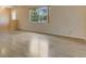 Inviting living room with hardwood floors and natural light streaming through a large window, enhancing the open space at 2772 Pelham Cir, Deltona, FL 32738